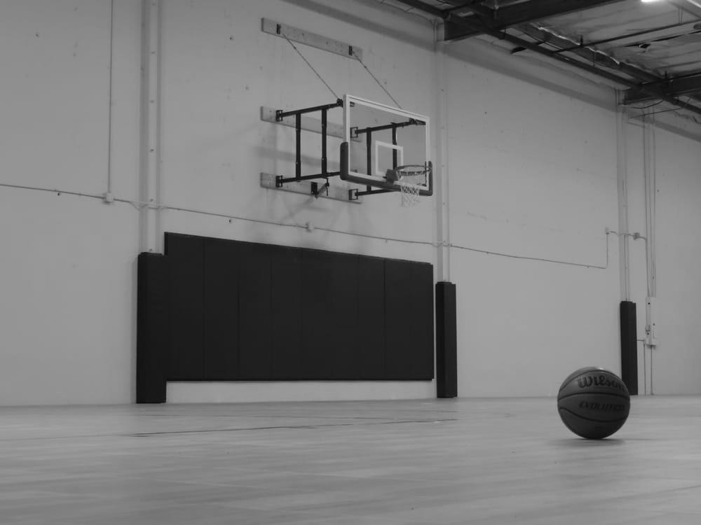 An empty court and wall-mounted hoop inside the Rockball gym in Rancho Cordova